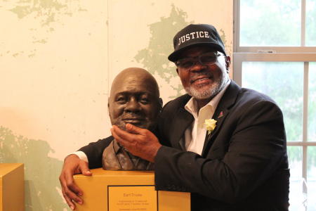 Earl Truvia with his bust