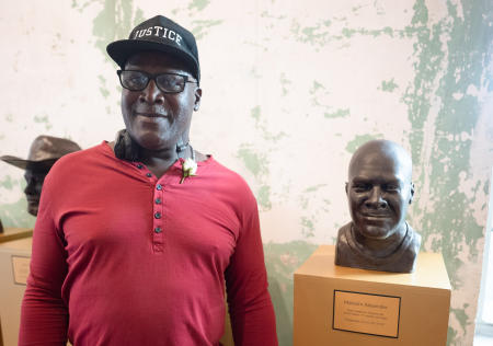 Malcolm Alexander with his bust