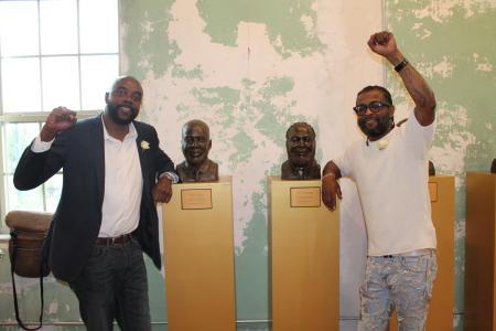 Robert Jones and Jerome Morgan with their portraits