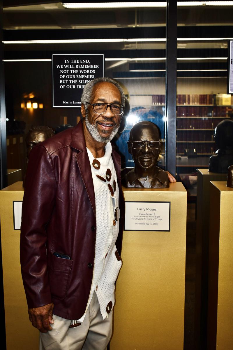 Larry Moses with his portrait.