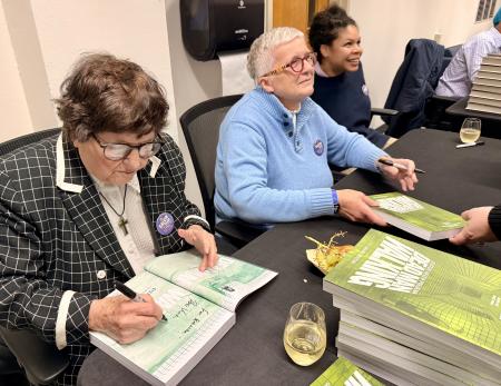 Sister Helen Prejean, Rose Vines and Catherine Anyango Grunewald signing books after the reception!