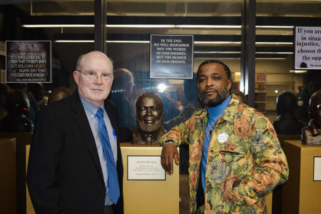 Jerome Morgan with Professor Bill Quigley and Jerome's portrait.