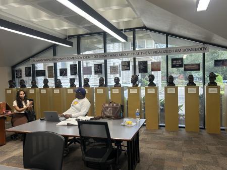 Two law students working at the study tables in the library.
